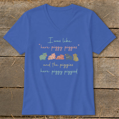 Blue t-shirt with cartoon pigs and text "I was like 'here piggy piggies' and the piggies here piggy piggied."