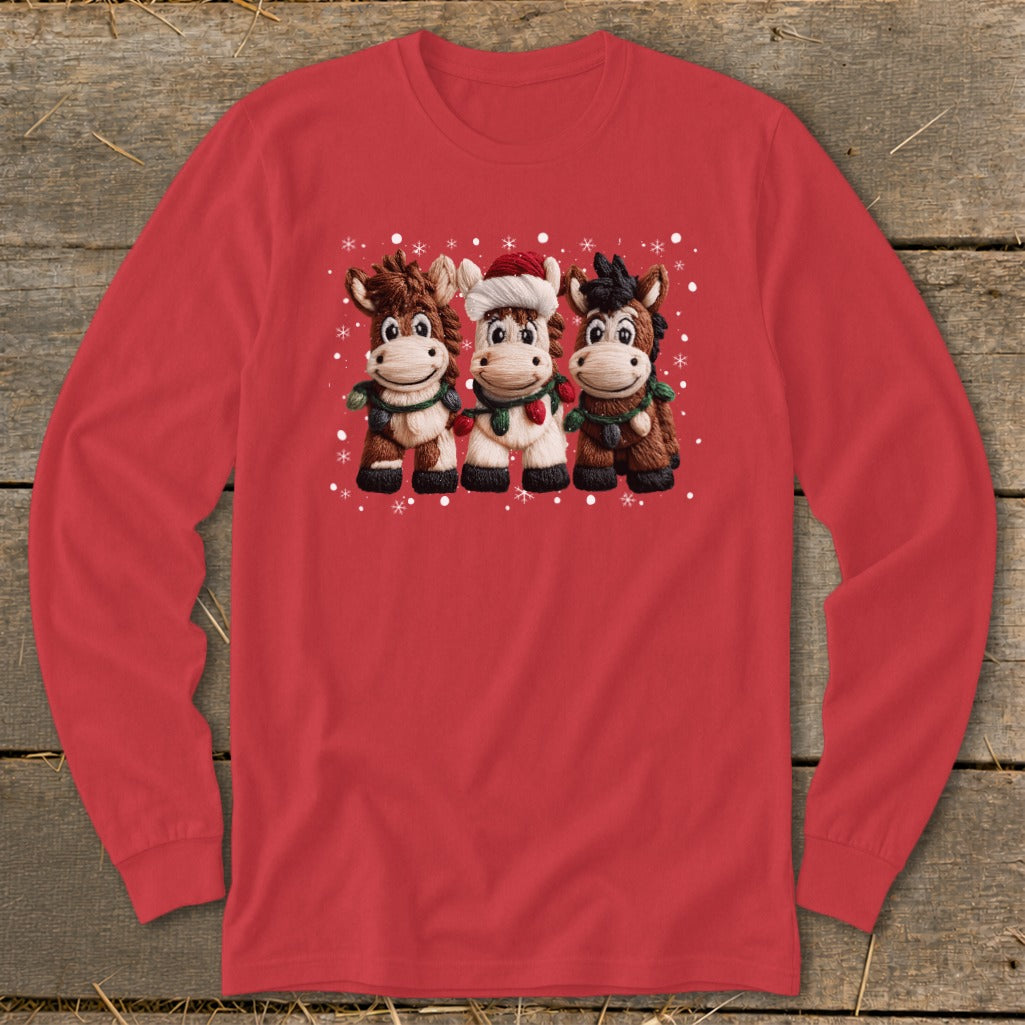 Three cartoon horses wearing scarves and one wearing a Santa hat with snowflakes.