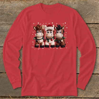 Three cartoon horses wearing scarves and one wearing a Santa hat with snowflakes.