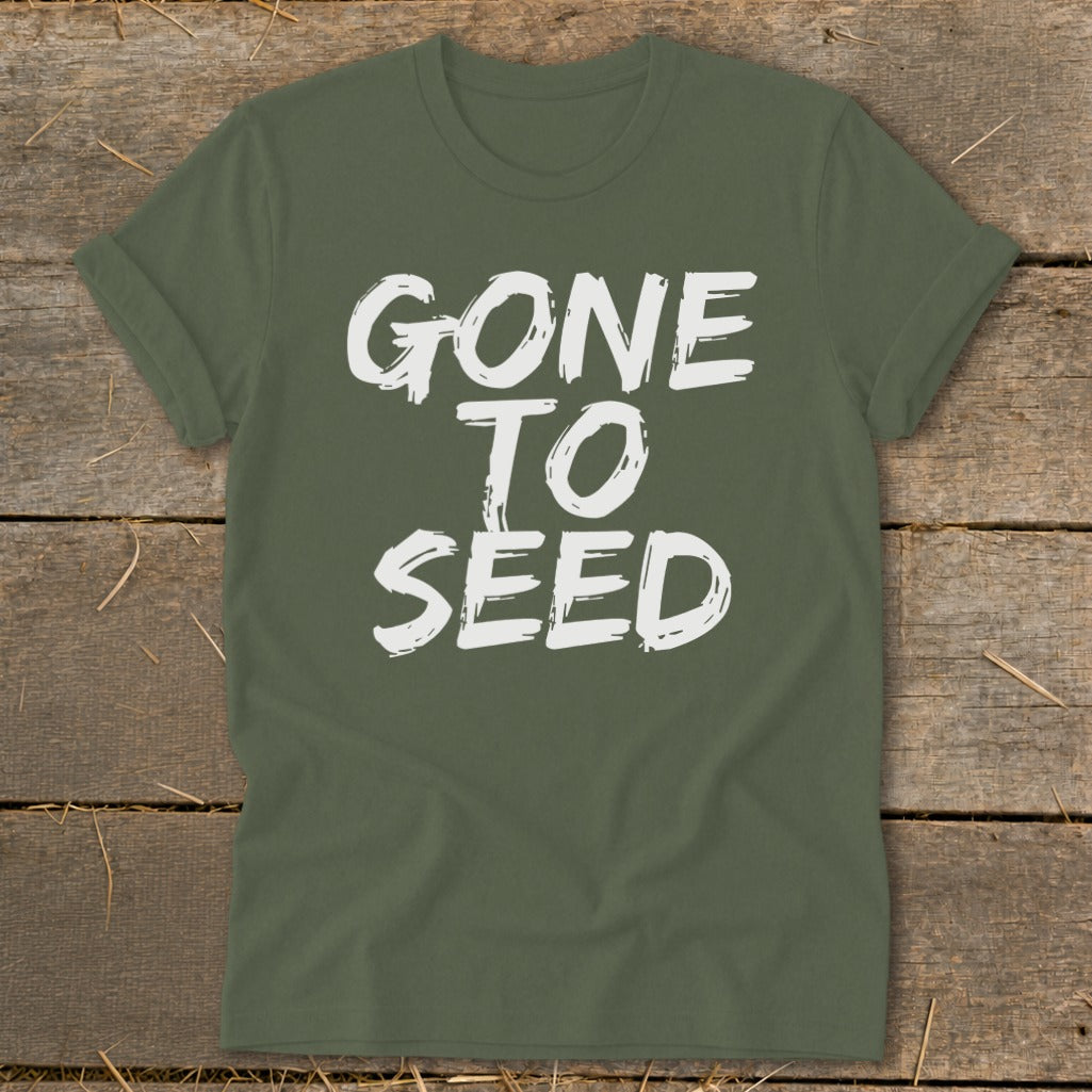 Green t-shirt with white text that reads "GONE TO SEED".