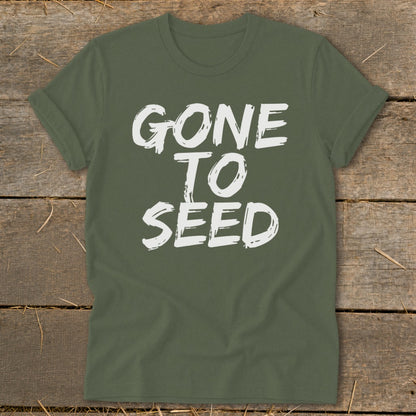 Green t-shirt with white text that reads "GONE TO SEED".