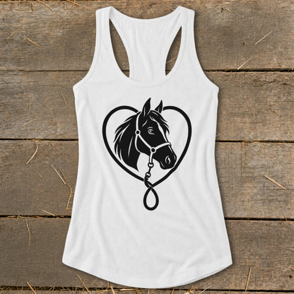 White women's racerback tank top featuring a black horse head silhouette inside a heart design, displayed flat on a rustic wooden background.