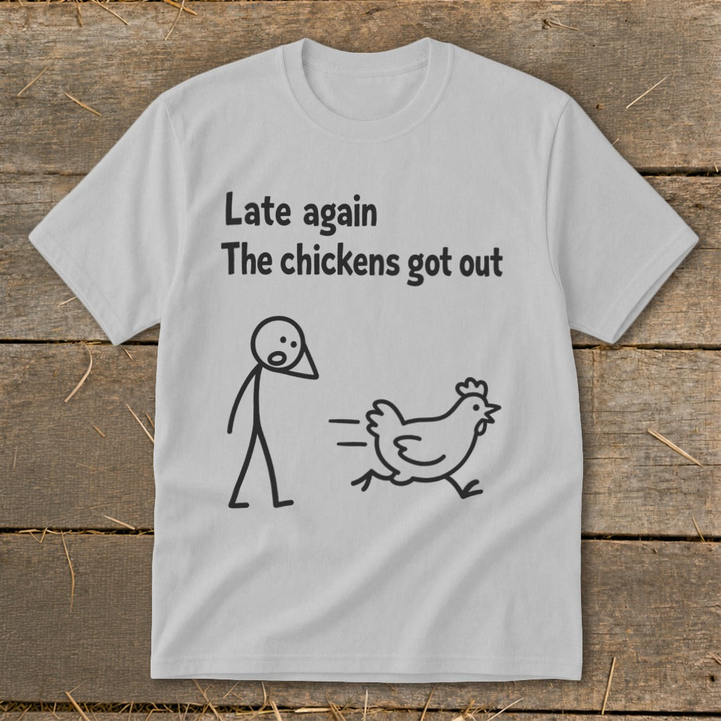 Light gray t-shirt with black text and stick figures of a person and a running chicken.