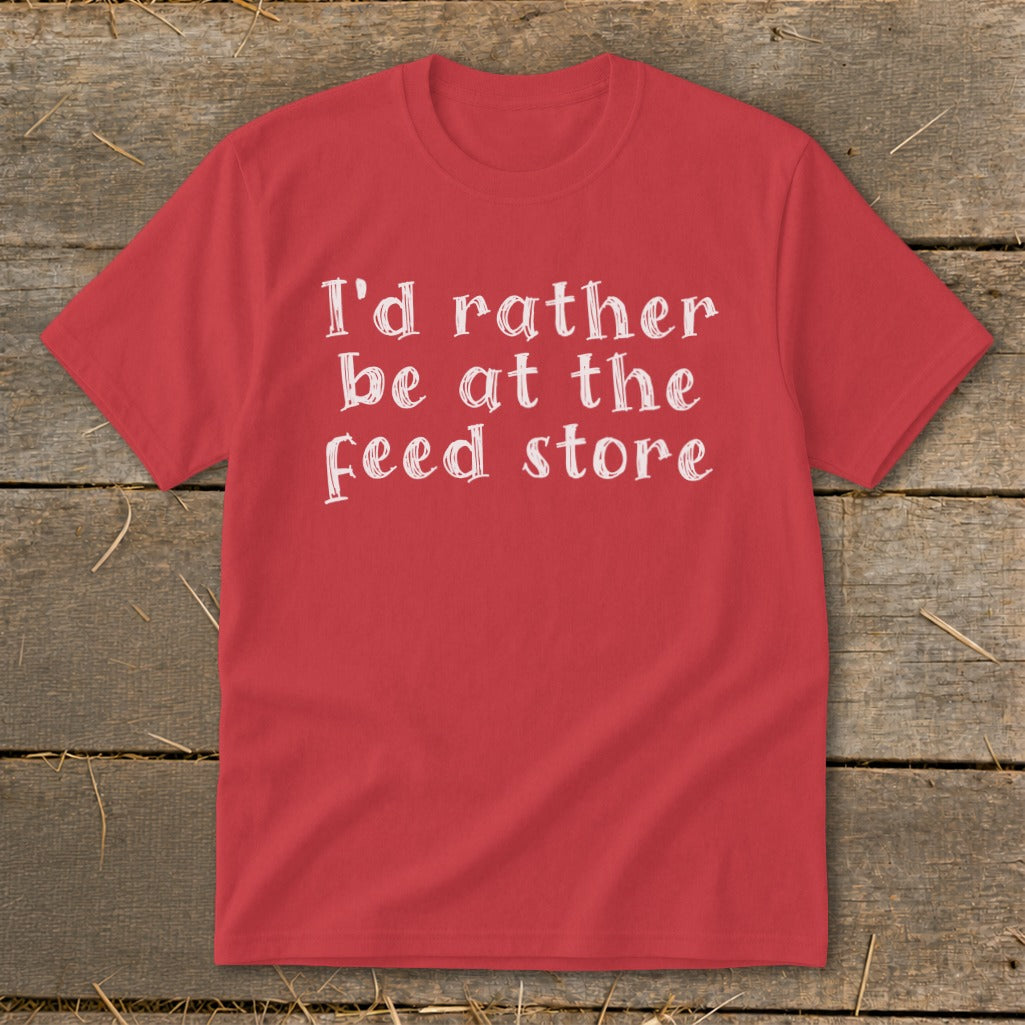 Red t-shirt with white text "I'd rather be at the feed store".