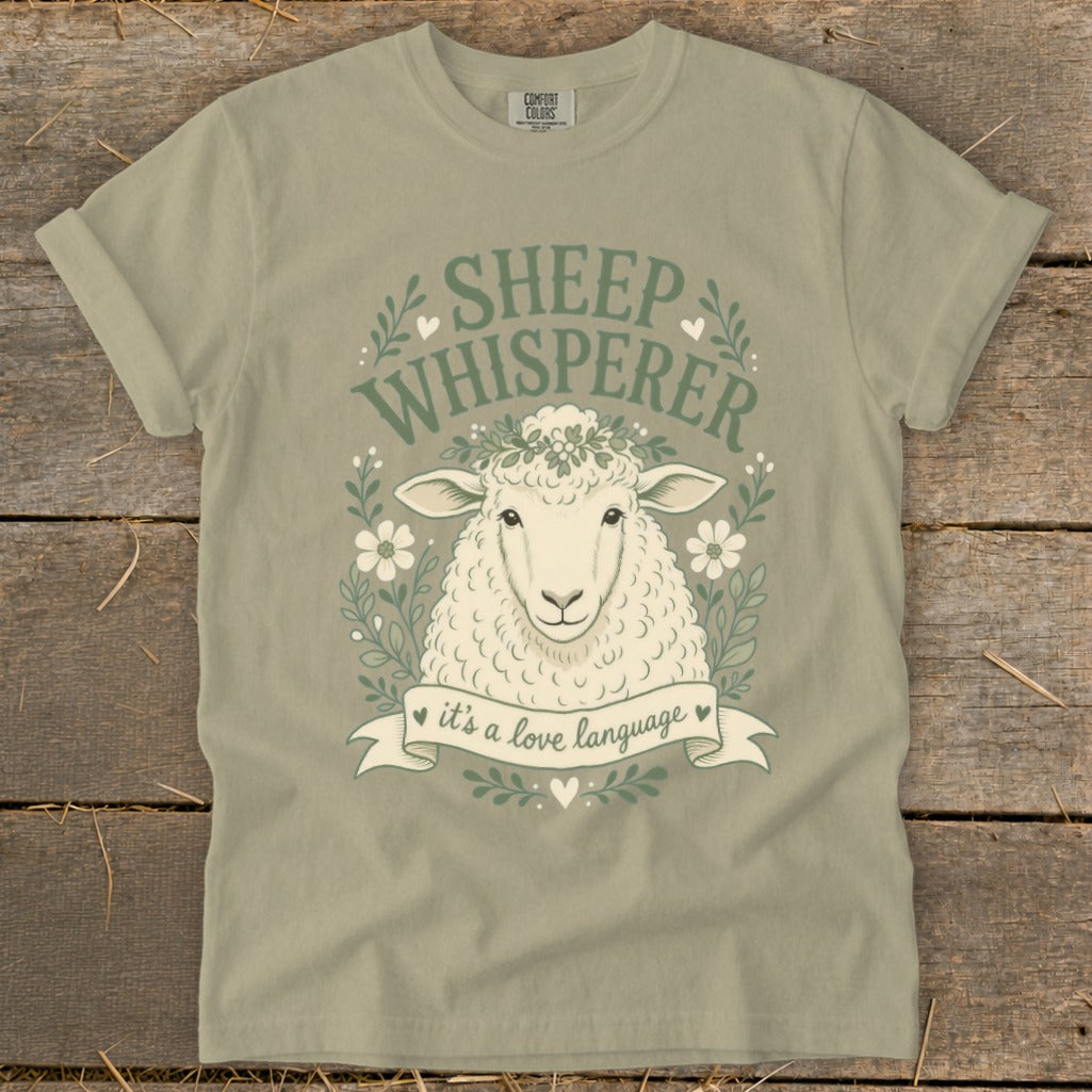 Olive green t-shirt with "Sheep Whisperer" graphic and sheep head.