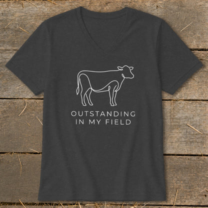 Dark grey t-shirt with a white line drawing of a cow and text.