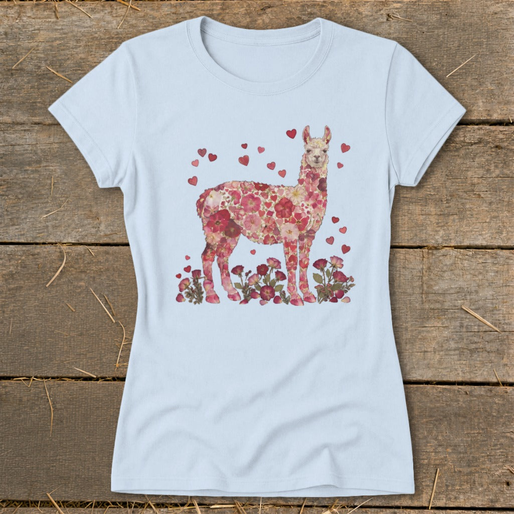 Light blue t-shirt with a floral llama design and scattered hearts.