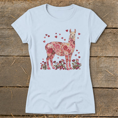 Light blue t-shirt with a floral llama design and scattered hearts.