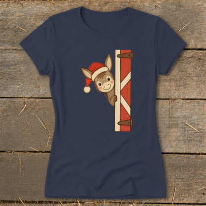 Navy t-shirt with a cartoon donkey in a Santa hat peeking from behind a barn door.