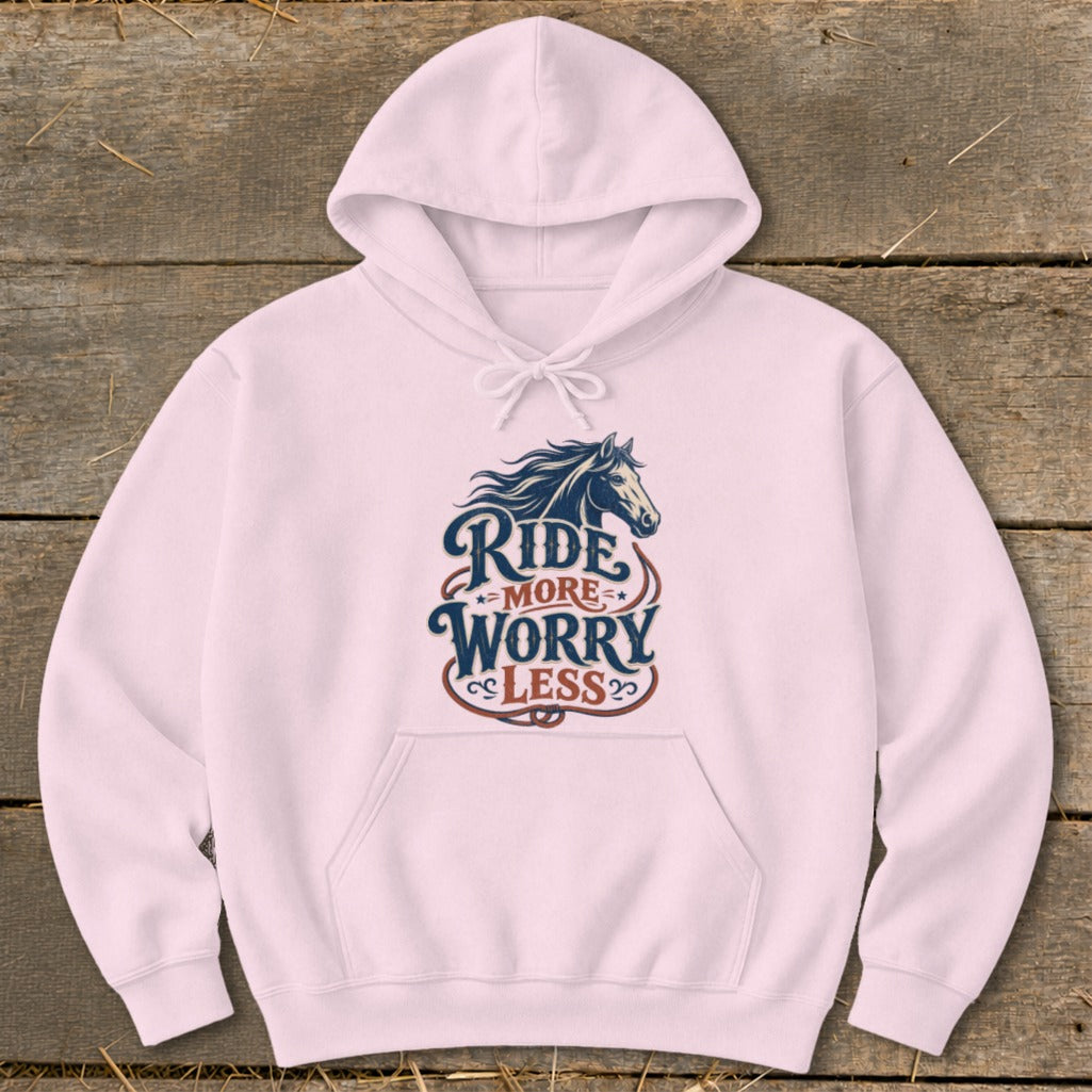 Pink hoodie with a dark blue horse graphic and "Ride More Worry Less" text.