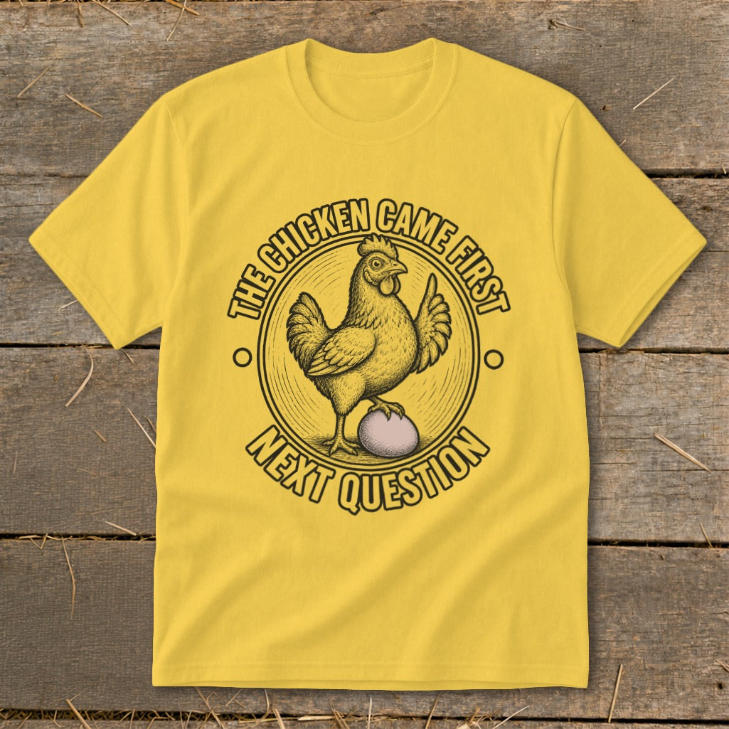 Yellow t-shirt with "The chicken came first" and "Next question" text and chicken graphic.