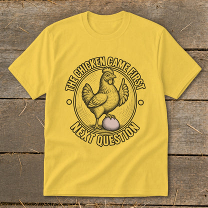 Yellow t-shirt with "The chicken came first" and "Next question" text and chicken graphic.