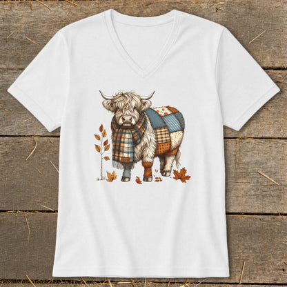 Highland cow with plaid scarf and patchwork body on a white v-neck shirt.
