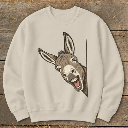 Cream sweatshirt with a cartoon donkey peeking around a corner, smiling broadly.