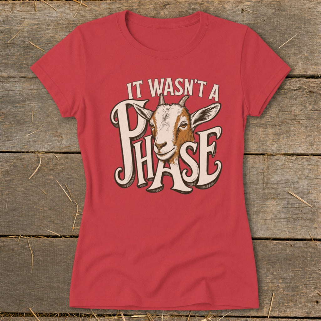 Red t-shirt with goat graphic and text "IT WASN'T A PHASE".
