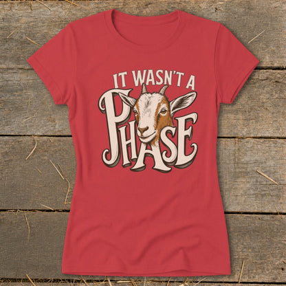 Red t-shirt with goat graphic and text "IT WASN'T A PHASE".