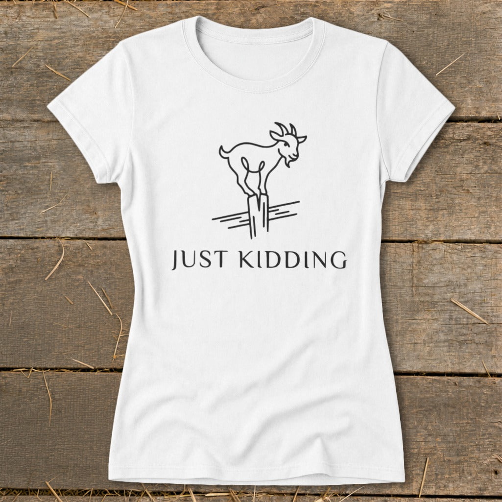 White t-shirt with a black line drawing of a goat standing on posts and the text "JUST KIDDING".