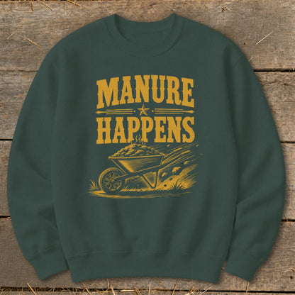 Dark green sweatshirt with yellow graphic text "MANURE HAPPENS" and a wheelbarrow filled with manure.