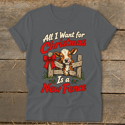 Cow with a red bow peeking through a fence, saying "All I Want for Christmas Is a New Fence."