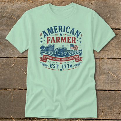 Light green t-shirt with "American Farmer Est. 1776" graphic and farm scene.