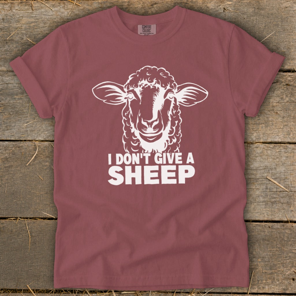 Maroon t-shirt with white sheep graphic and "I Don't Give a Sheep" text.