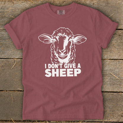 Maroon t-shirt with white sheep graphic and "I Don't Give a Sheep" text.