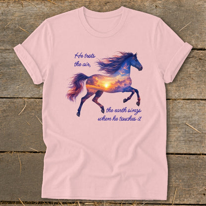A light pink t-shirt displays a running horse filled with a sunset sky graphic and inspirational text.
