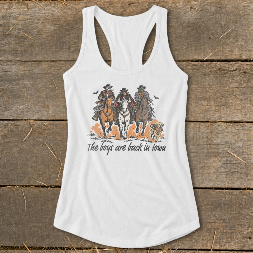 White tank top with illustration of three cowboys on horseback and a dog, text reads "The boys are back in town".
