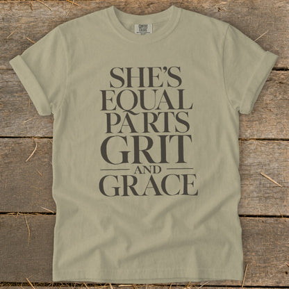 Light tan t-shirt with text "She's Equal Parts Grit and Grace."