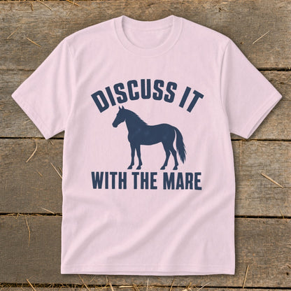 Pink t-shirt with a dark blue horse silhouette and "Discuss it with the mare" text.
