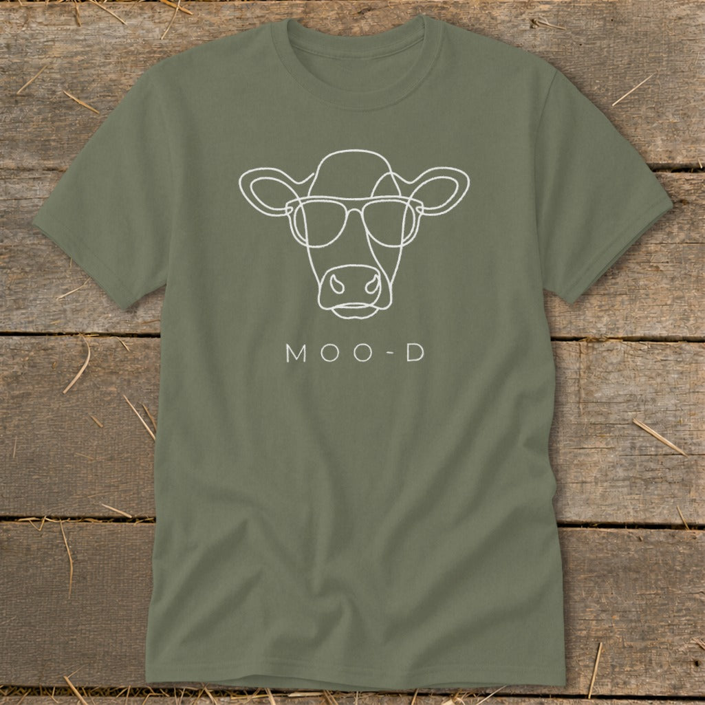 Green t-shirt with white line art of a cow wearing sunglasses and the text "MOO-D".