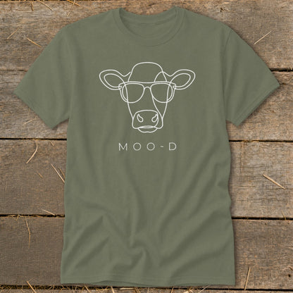 Green t-shirt with white line art of a cow wearing sunglasses and the text "MOO-D".