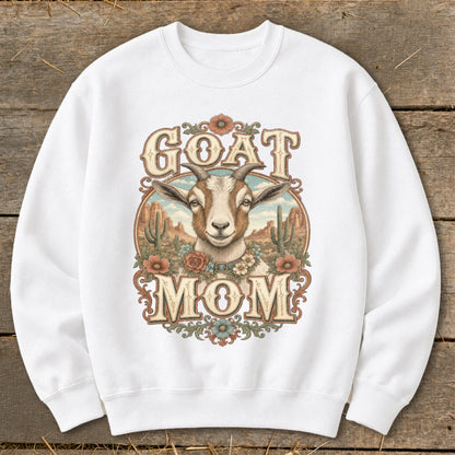 White sweatshirt with a desert scene featuring a goat and the text "GOAT MOM".
