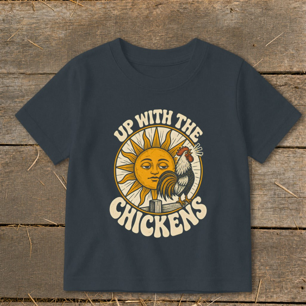 Dark gray short-sleeved t-shirt featuring a retro graphic of a sun and rooster with text reading "UP WITH THE CHICKENS."
