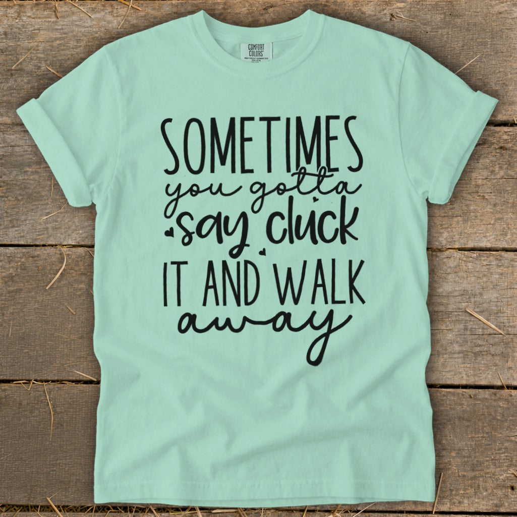 Light mint t-shirt with black text that says "Sometimes you gotta say cluck it and walk away."