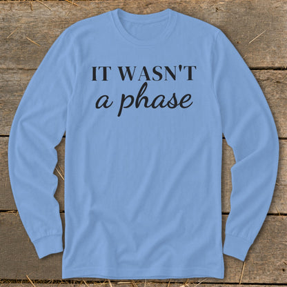 Light blue long-sleeve shirt with black text "IT WASN'T a phase".