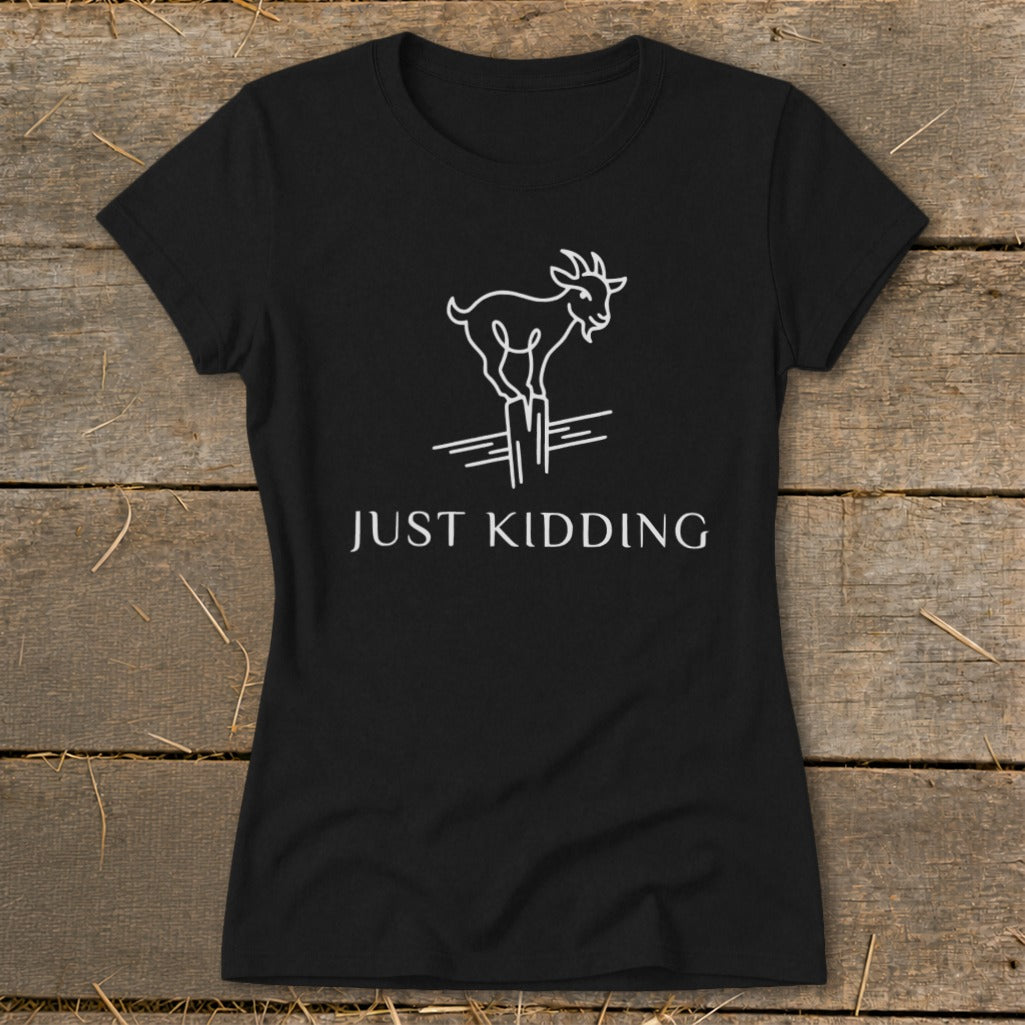 Black t-shirt with a white line drawing of a goat standing on posts with the text "JUST KIDDING".