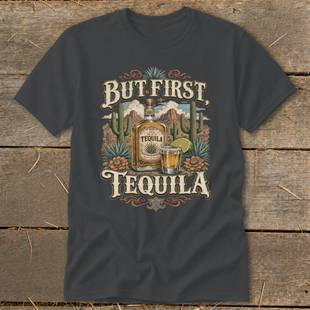 T-shirt graphic with text "BUT FIRST TEQUILA" and illustration of a tequila bottle and shot glass.
