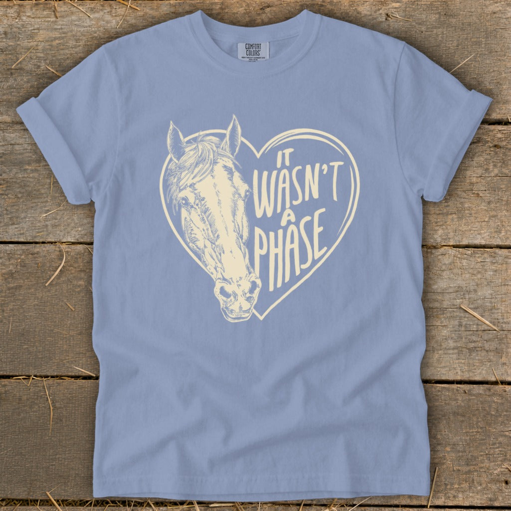 Blue t-shirt with a cream-colored horse head inside a heart with text.