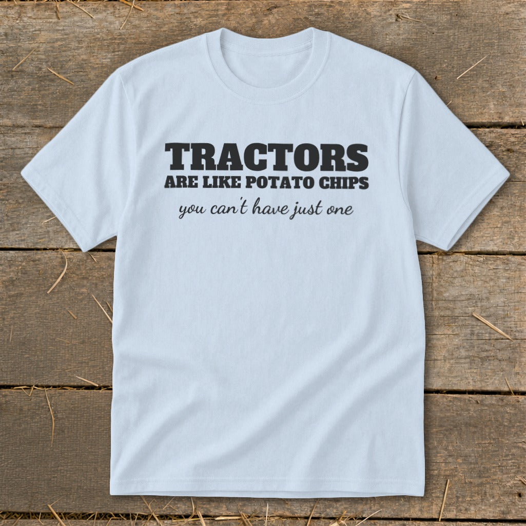 Light blue t-shirt with black text that reads "TRACTORS ARE LIKE POTATO CHIPS you can't have just one."