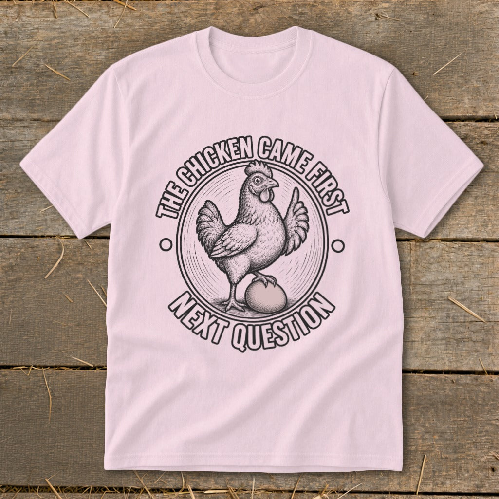 T-shirt with a chicken and egg graphic that reads "The chicken came first. Next question."