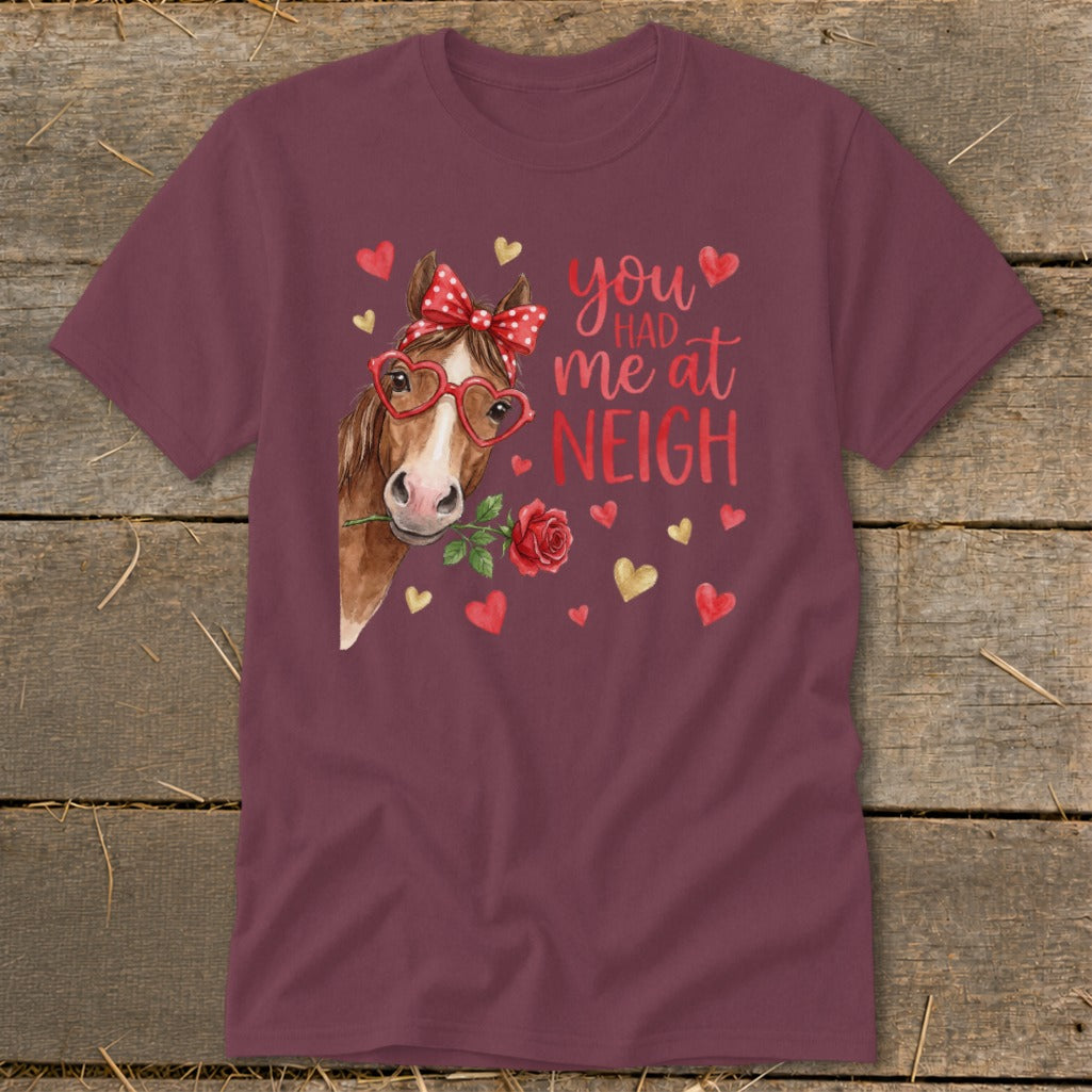 Horse wearing heart glasses and bow, holding a rose, with text "you had me at NEIGH".