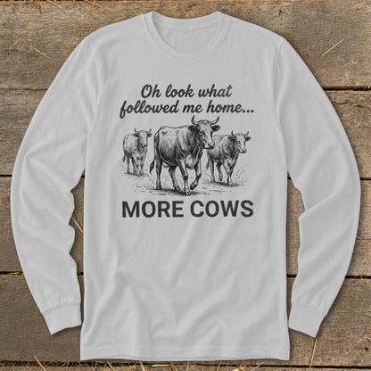 Long sleeve shirt with sketch of cows and text "Oh look what followed me home... MORE COWS".