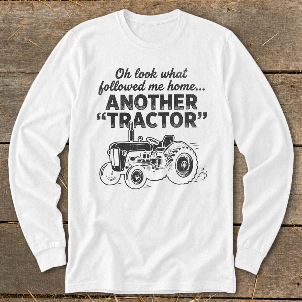 White long sleeve shirt with text and tractor graphic.