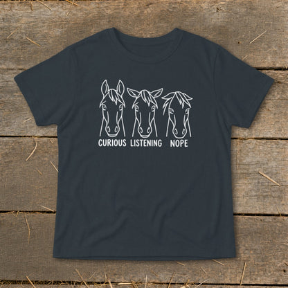 Dark gray t-shirt featuring a white line art graphic of three horses with the text curious listening nope.