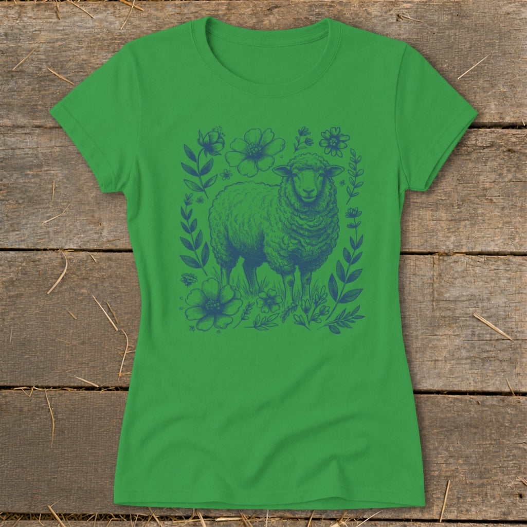 Green t-shirt with a blue line drawing of a sheep surrounded by flowers and leaves.