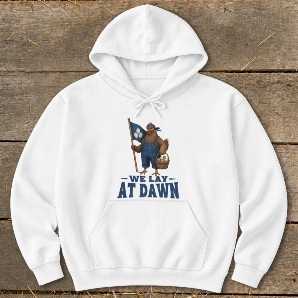 White hoodie with a chicken holding a flag and basket. Text reads "We Lay At Dawn".