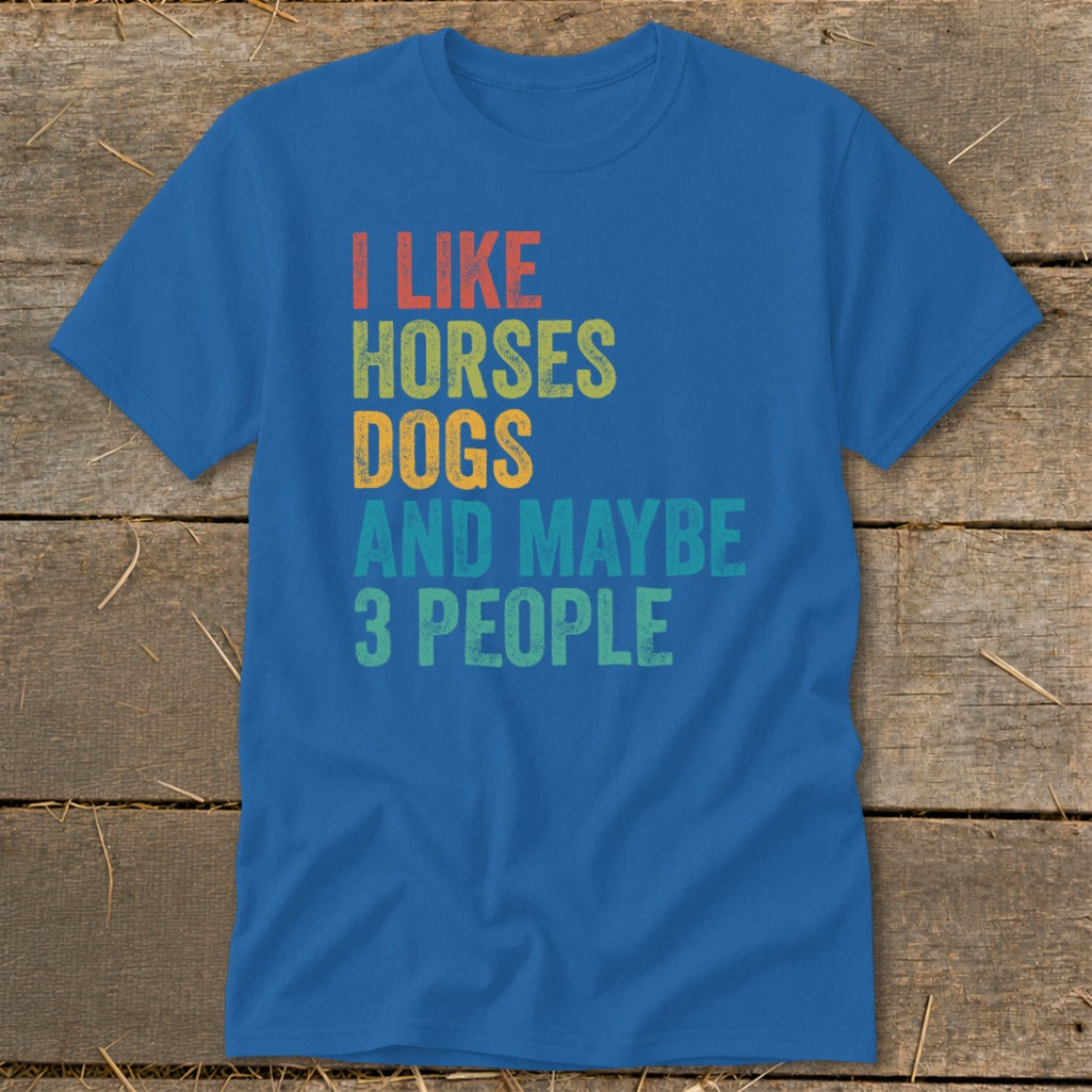 Blue t-shirt with text "I LIKE HORSES DOGS AND MAYBE 3 PEOPLE".