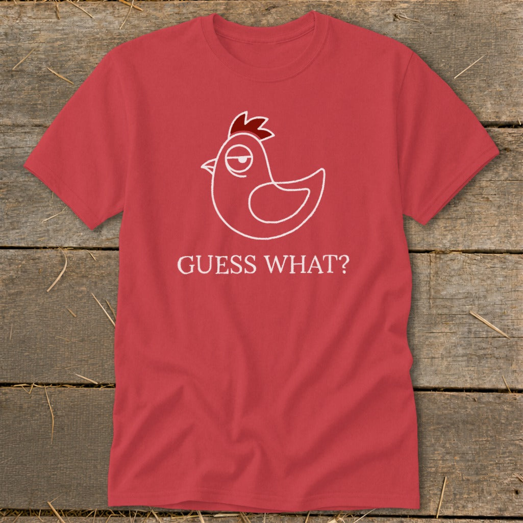 Red t-shirt with a white outline of a chicken and the text "GUESS WHAT?".