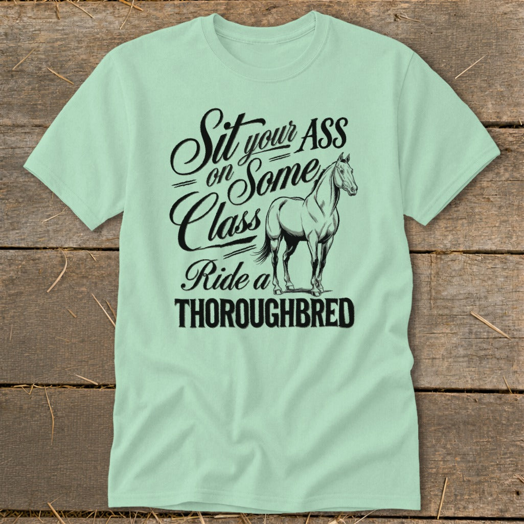 Light green t-shirt with black text and thoroughbred horse graphic.